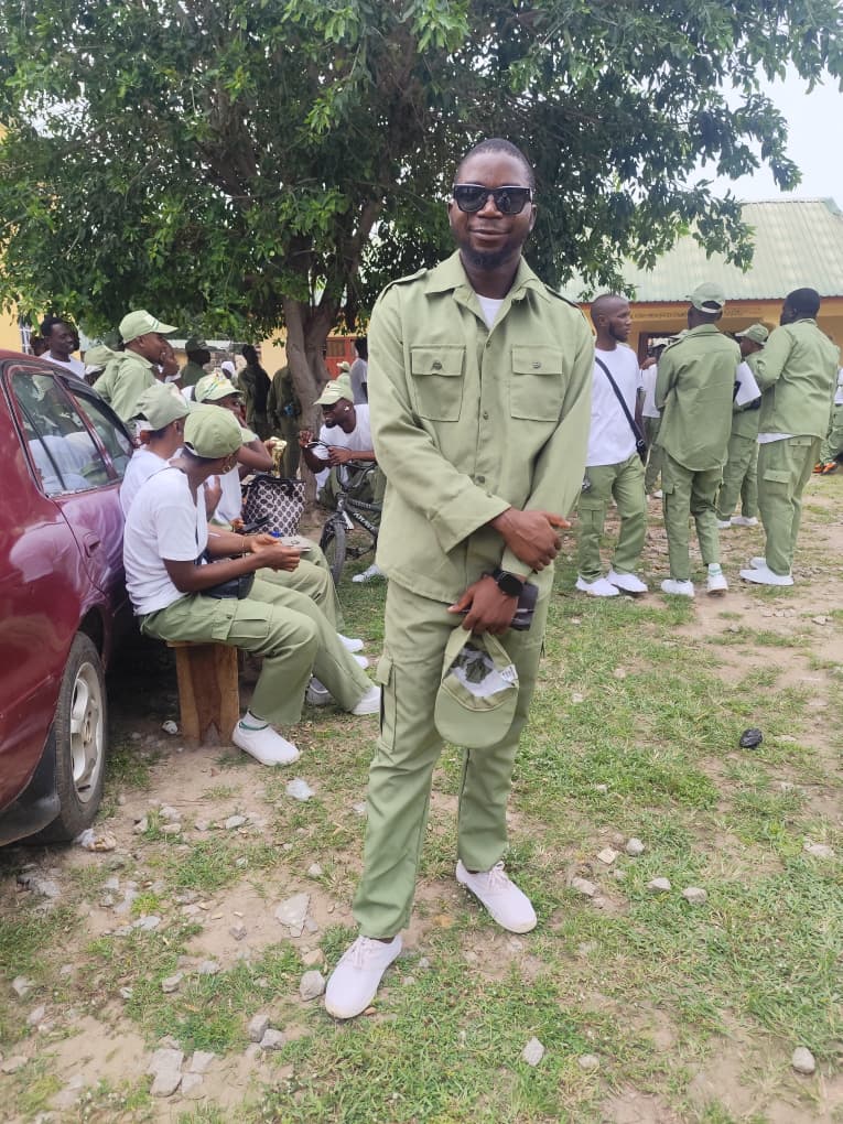 Rasheed in NYSC uniform with fellow corps members at monthly clearance